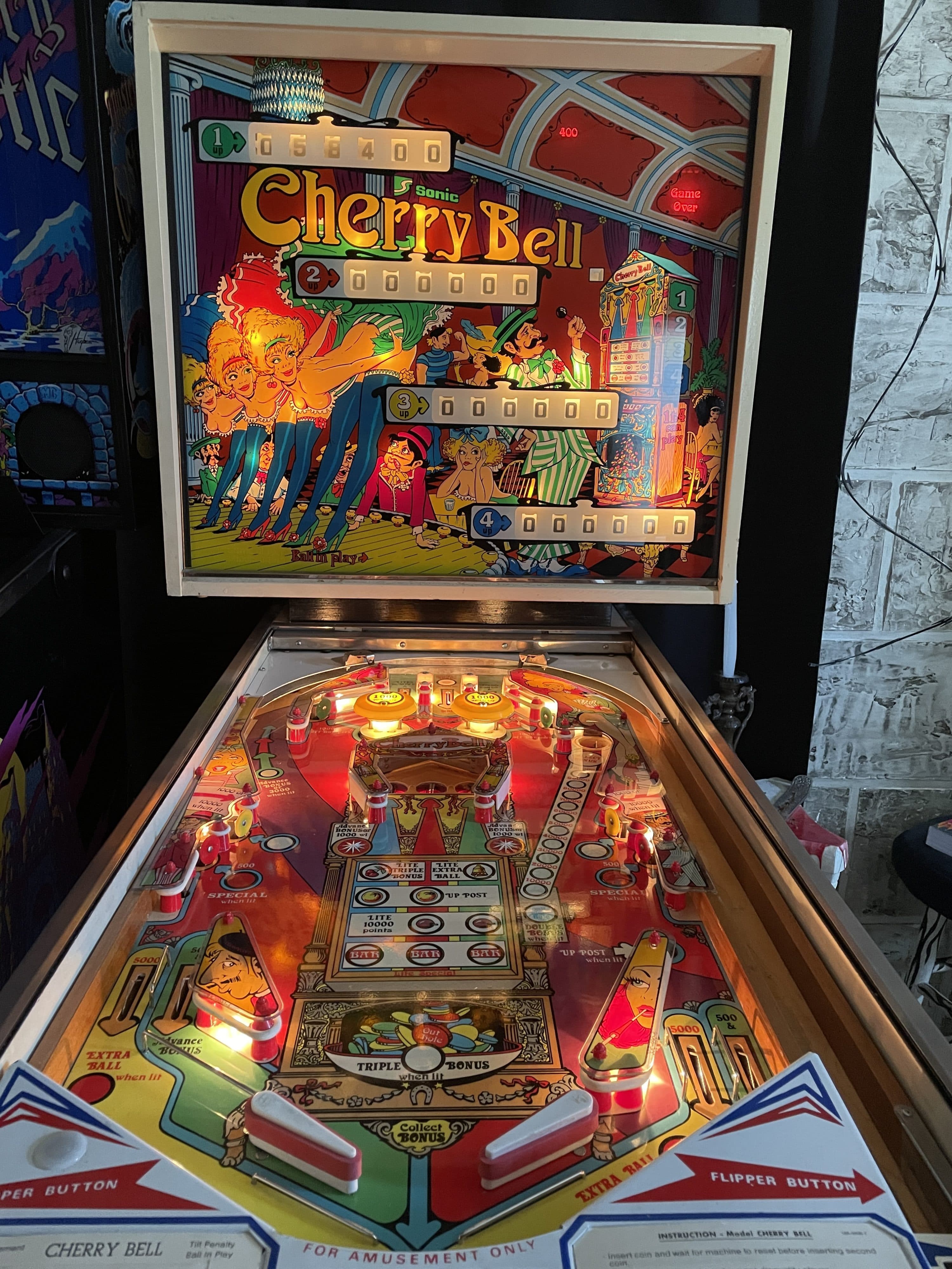 Vintage Cherry Bell pinball machine with colorful playfield and backglass