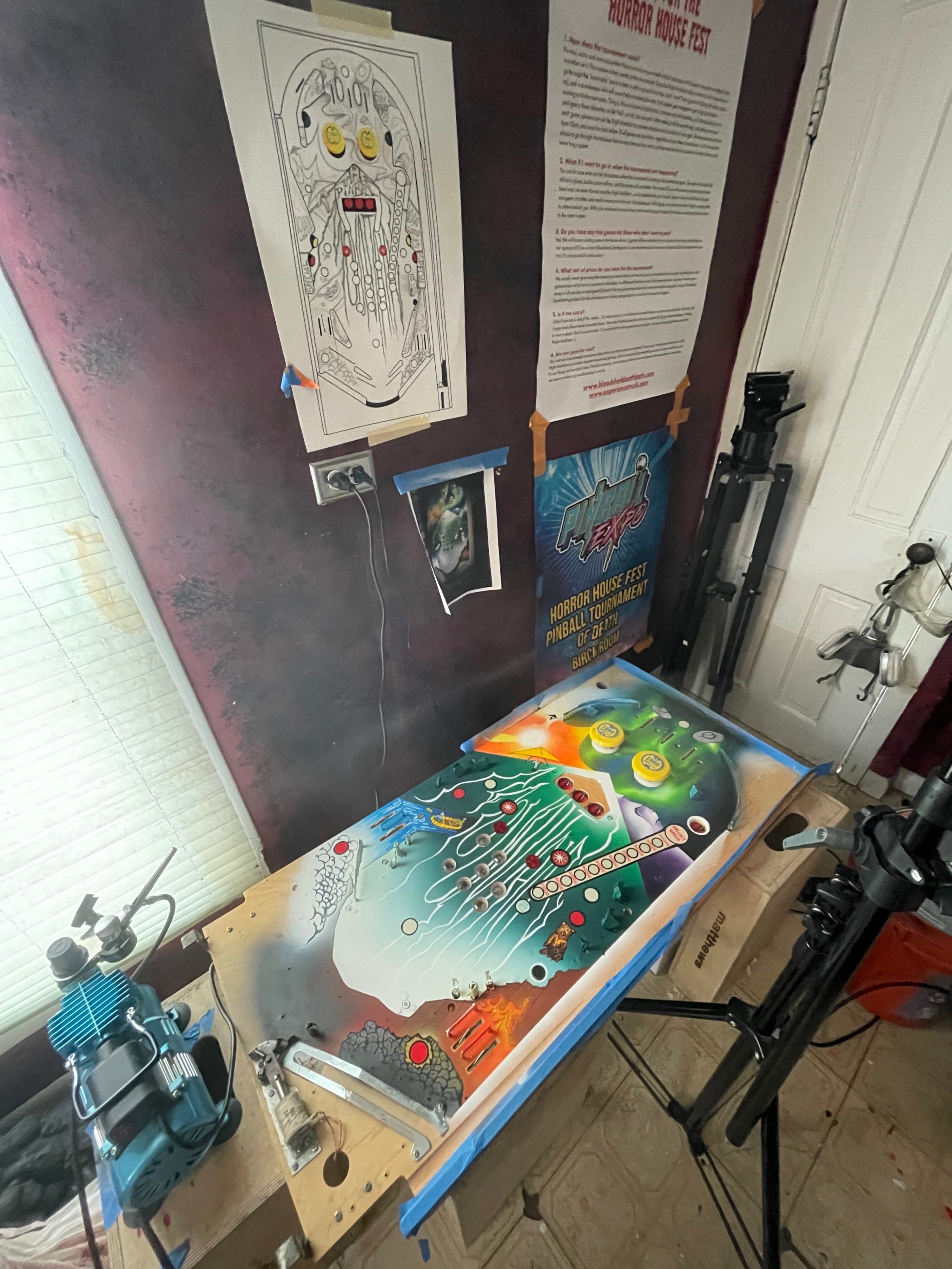 Colorful pinball machine playfield with Horror House Fest tournament poster