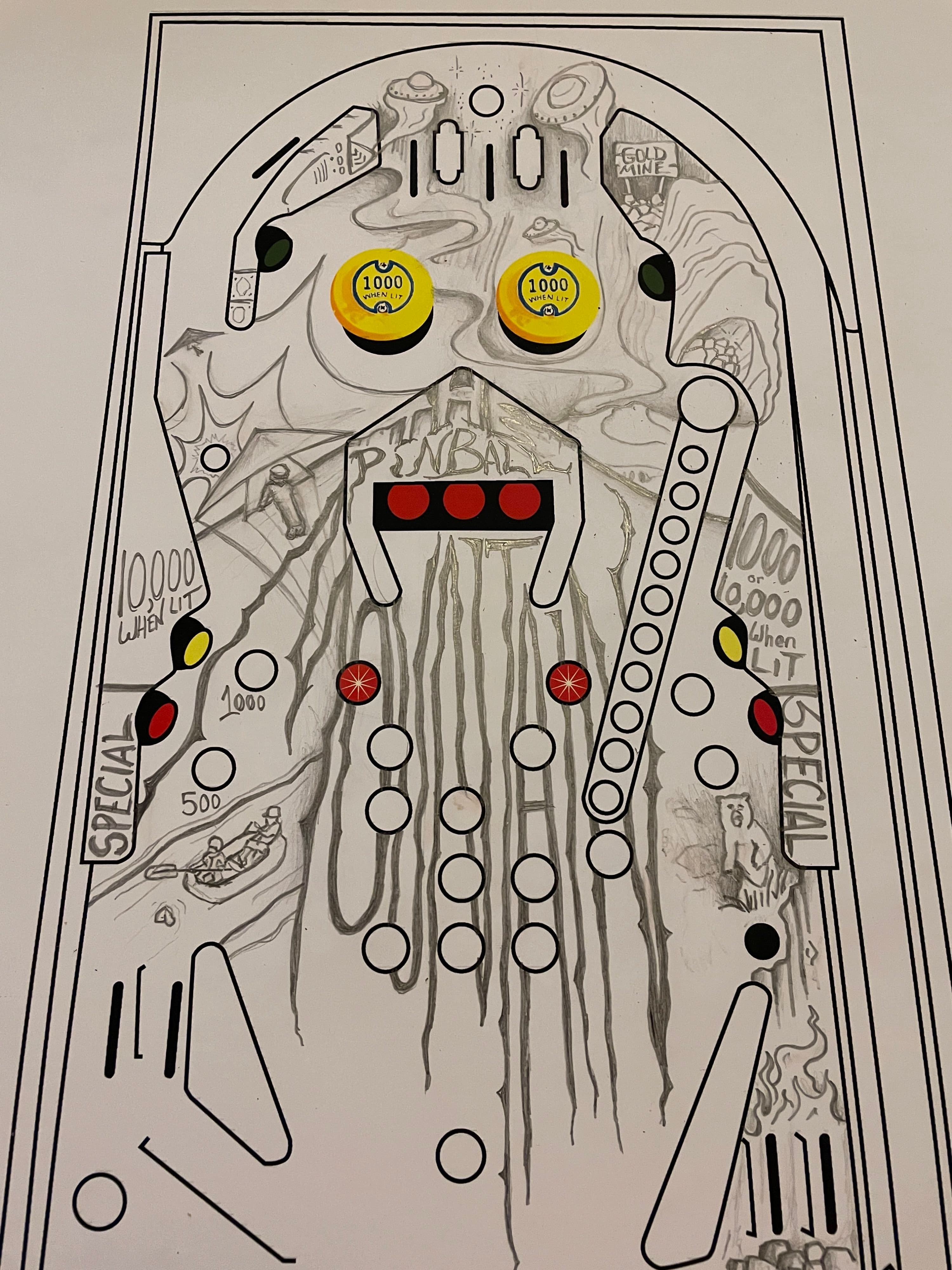 Detailed pinball machine playfield design with scoring zones and yellow bumpers