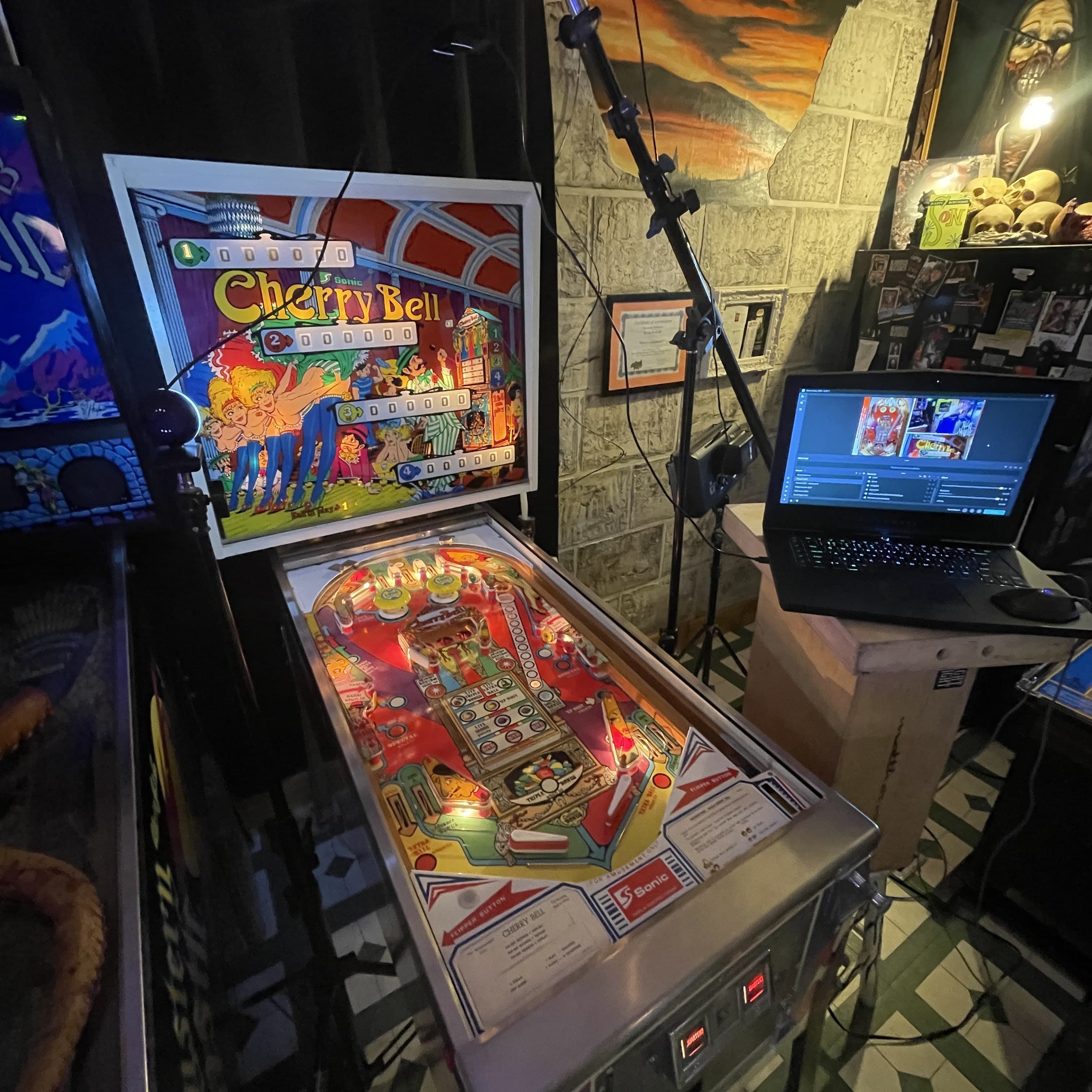 Vintage Cherry Bell pinball machine with colorful playfield and backglass