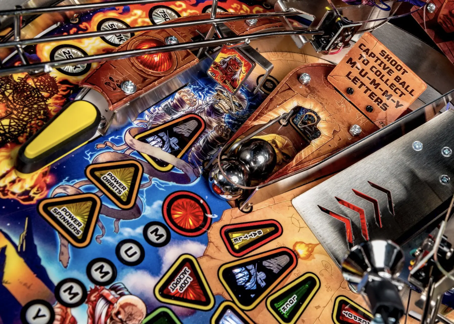 Colorful pinball machine with vibrant graphics and metallic components