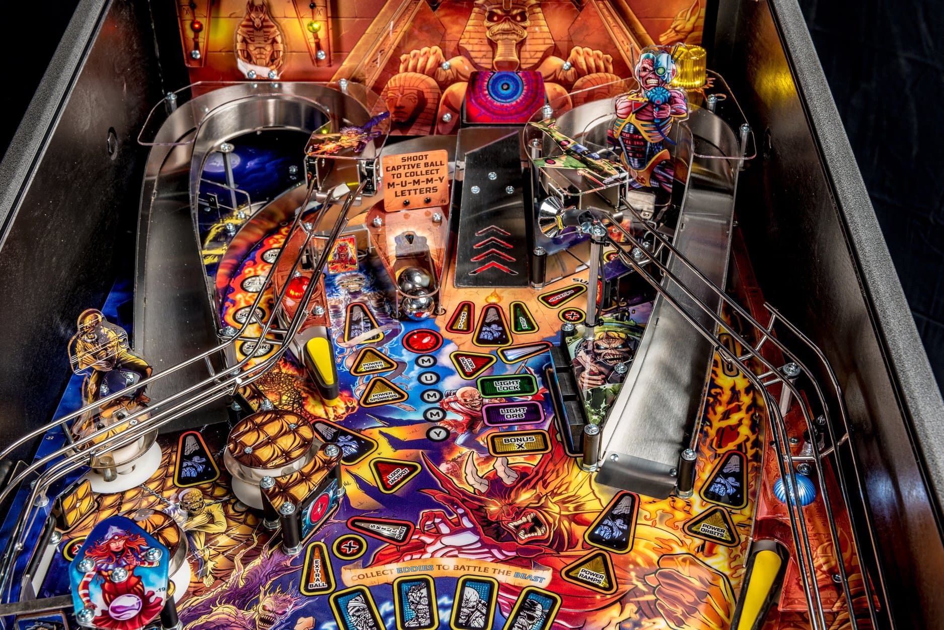 Colorful pinball machine with Egyptian and mythical themes, intricate playfield design