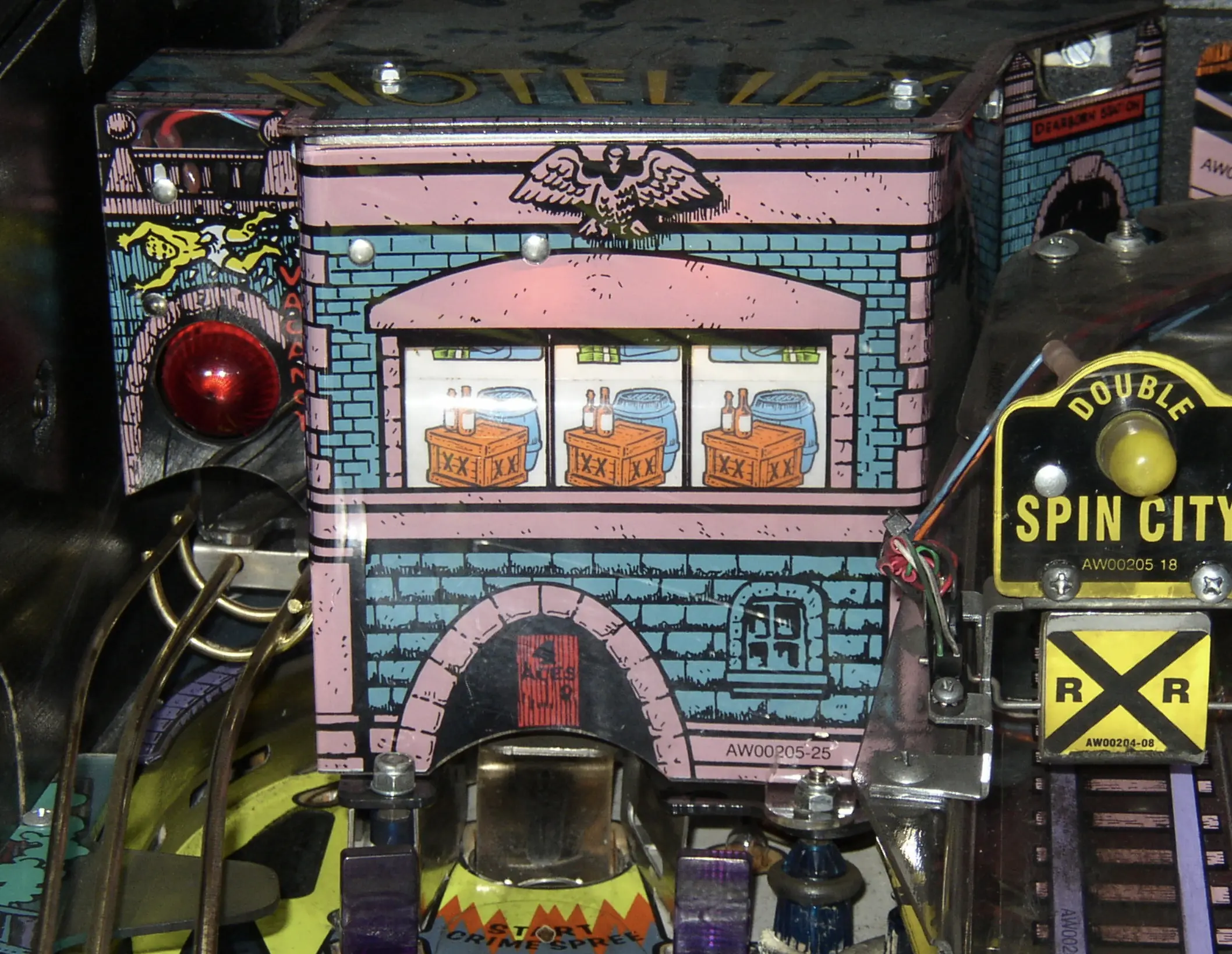 Vintage pinball machine backglass with brick building and wooden crates