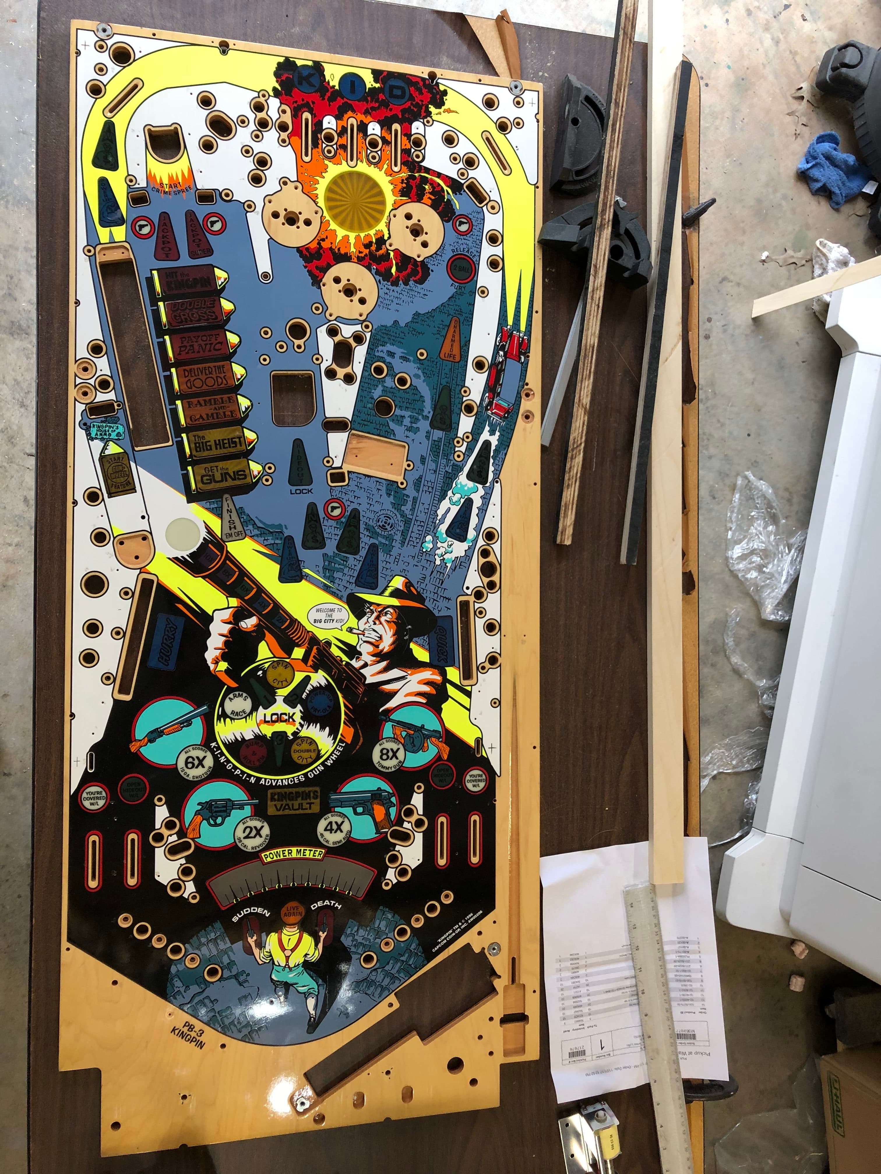 Colorful pinball machine playfield with cartoon characters and game elements