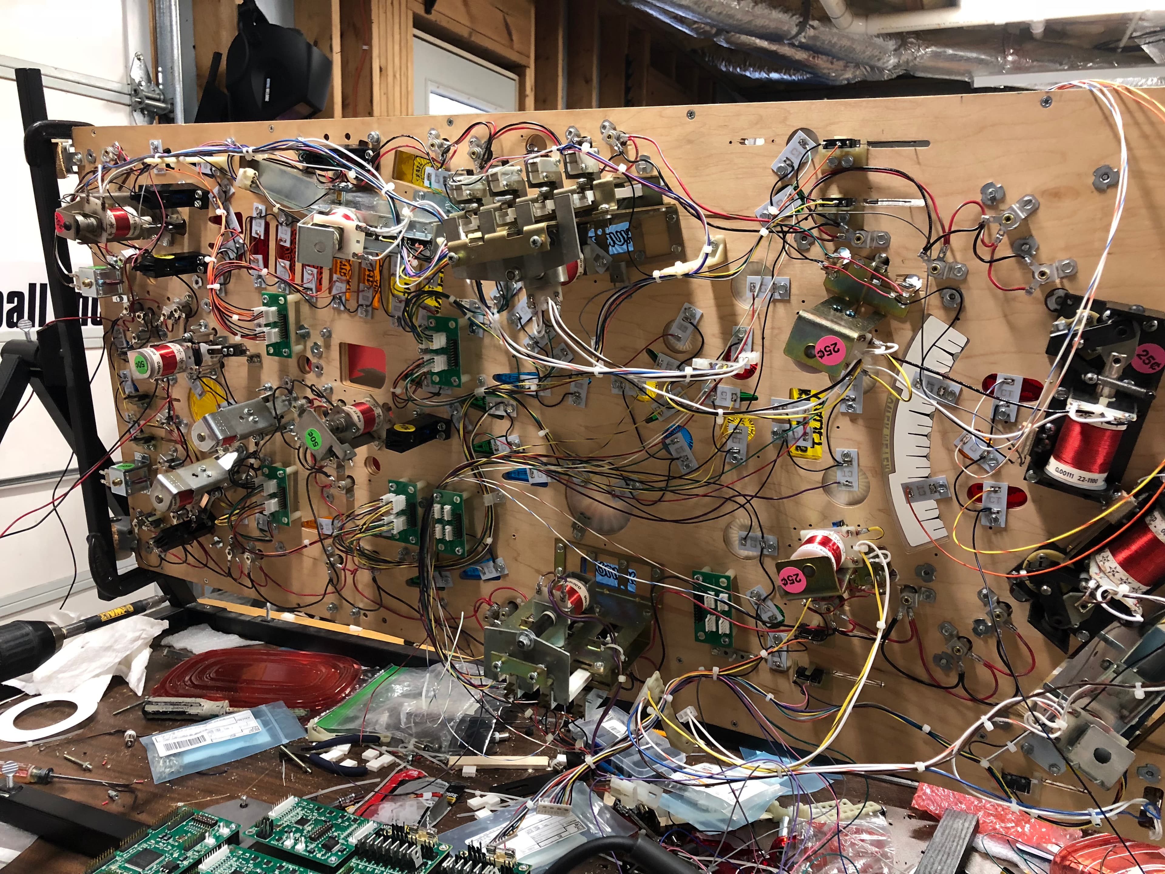 Complex electronic circuit board with numerous wires, components, and connections