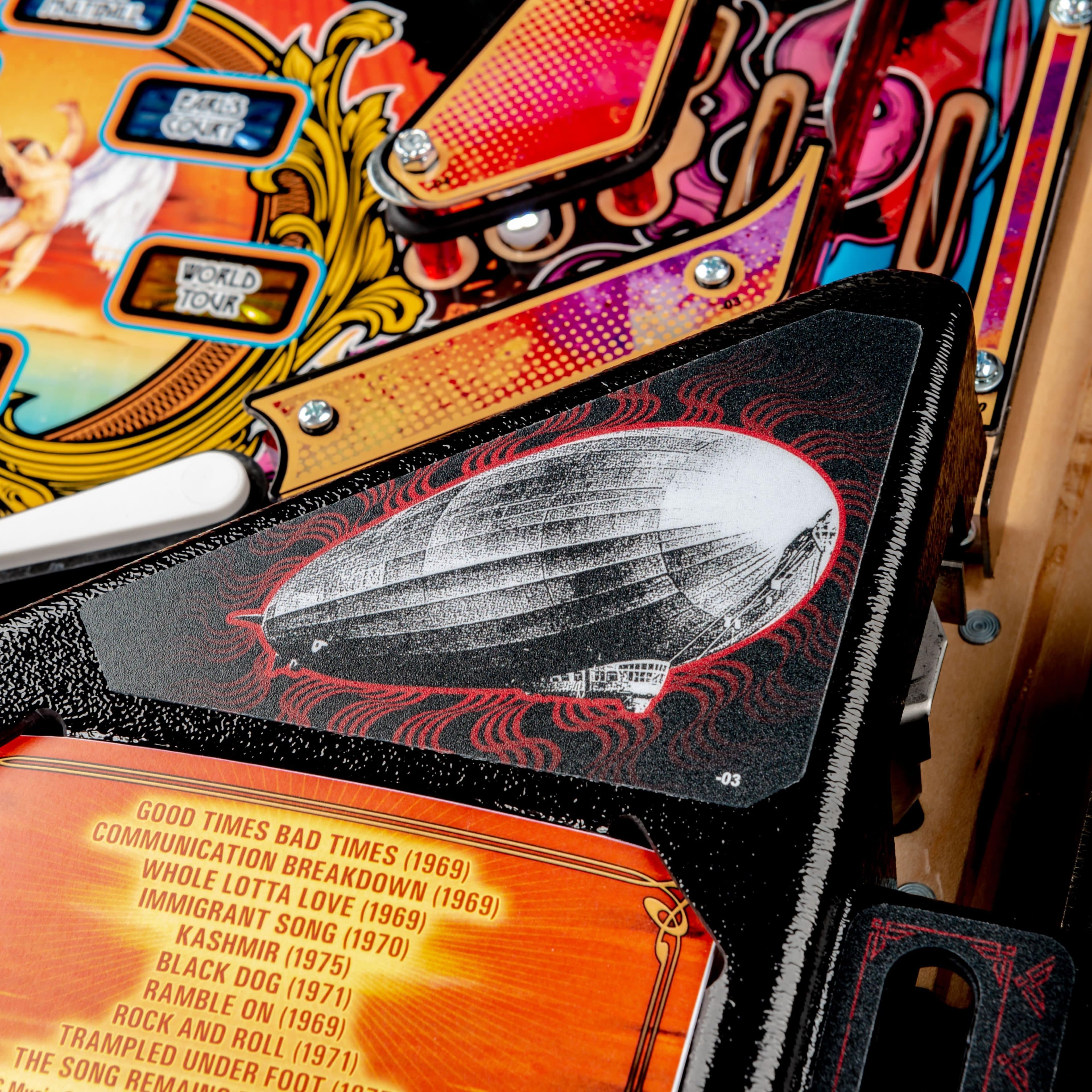 Vintage pinball machine with zeppelin illustration and song list