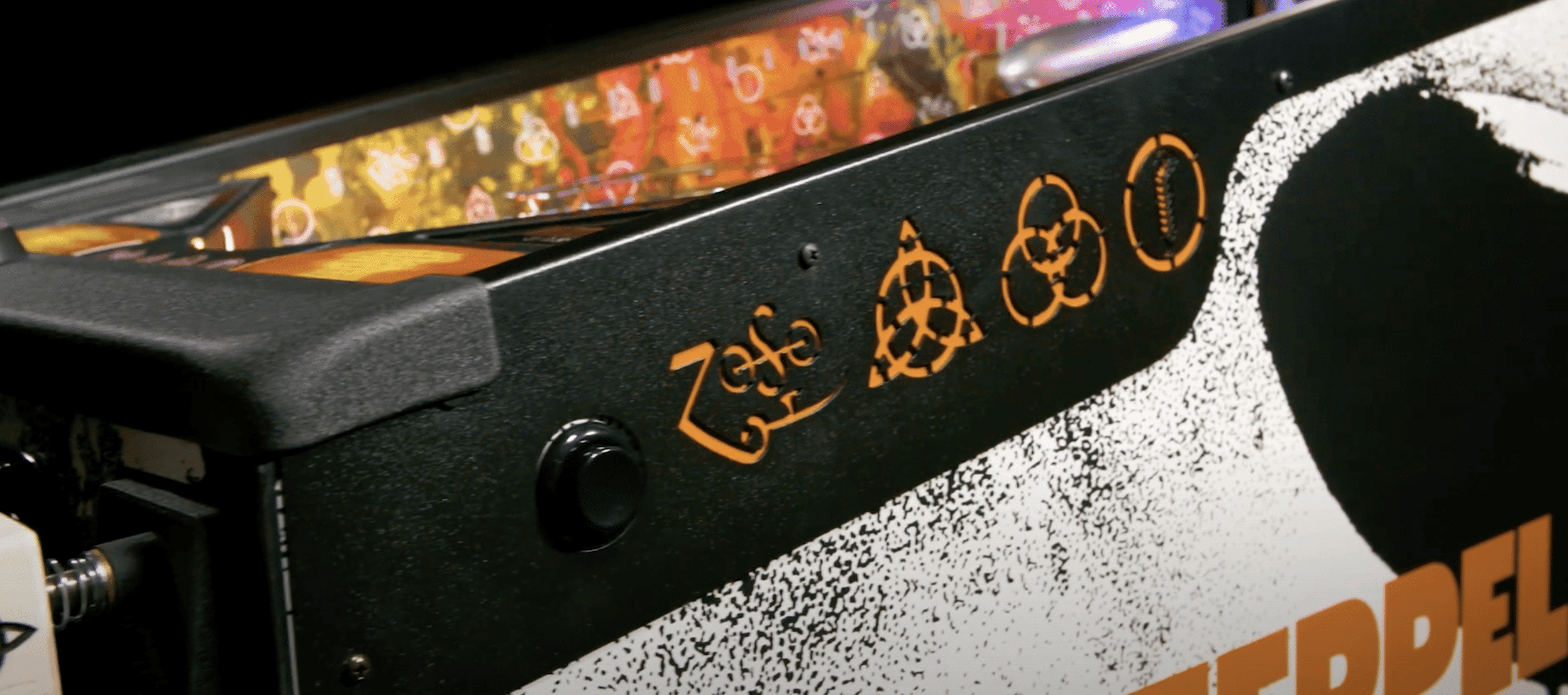 Black electronic device with biohazard symbols in orange