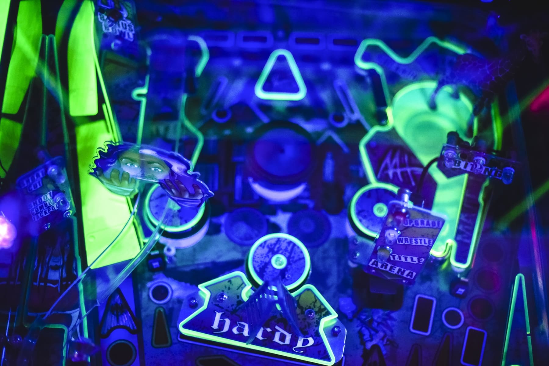 Neon green and blue cyberpunk-style collage with glowing geometric shapes