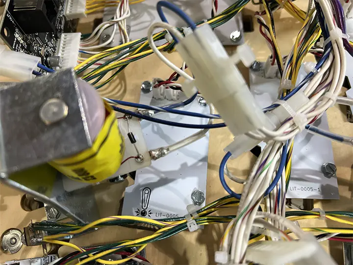 Tangled electrical wires and components on a circuit board