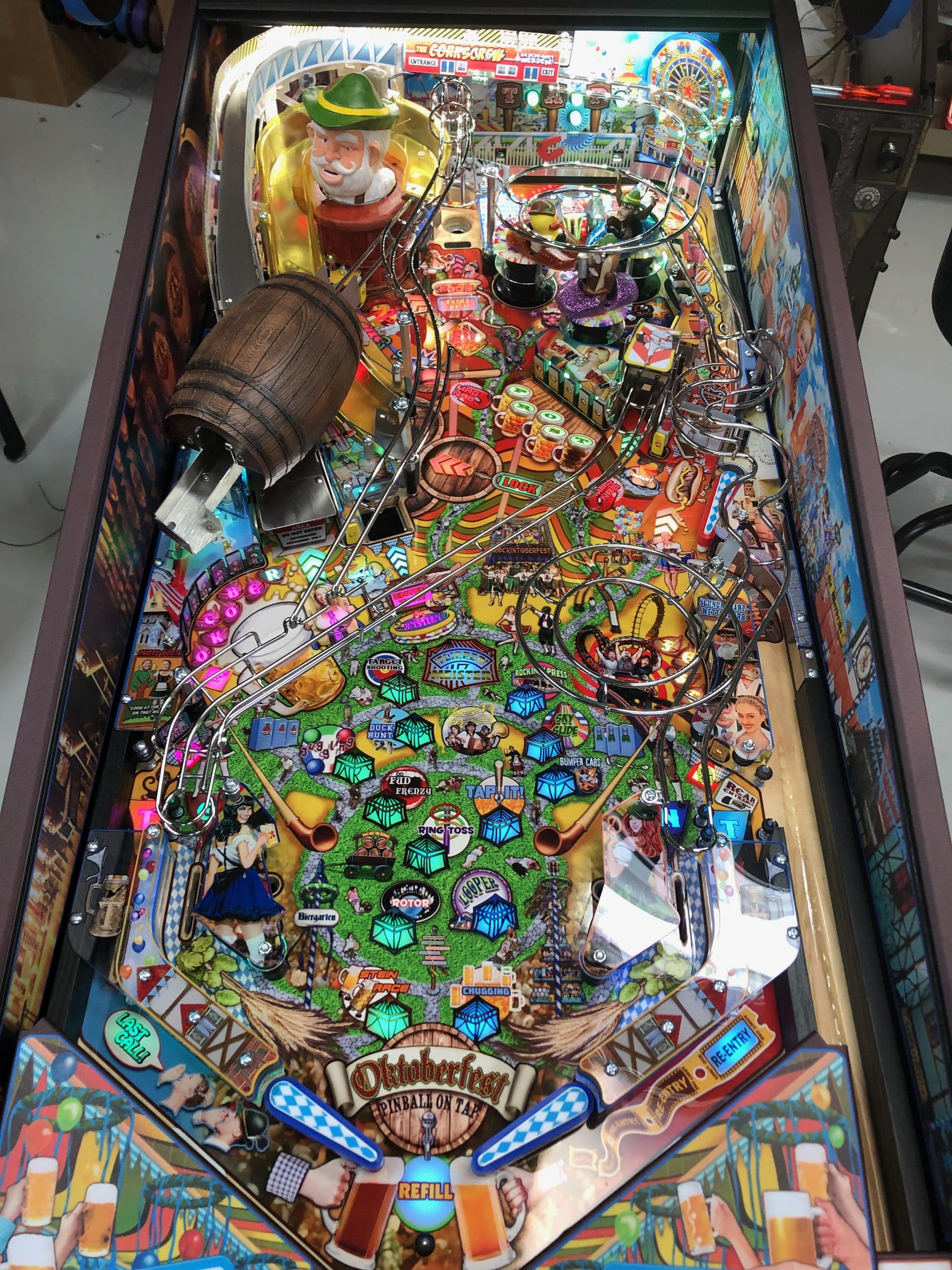 Colorful Oktoberfest-themed pinball machine with intricate playfield details