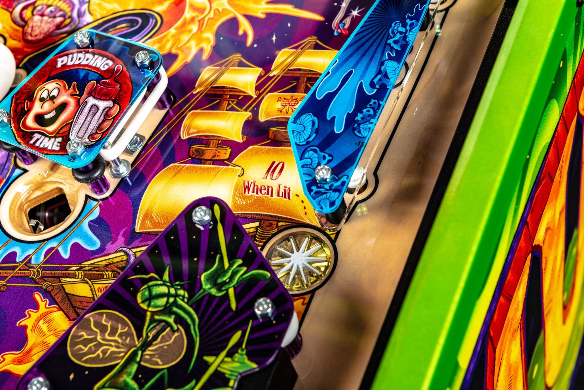 Colorful pinball machine with cartoon characters and vibrant graphics