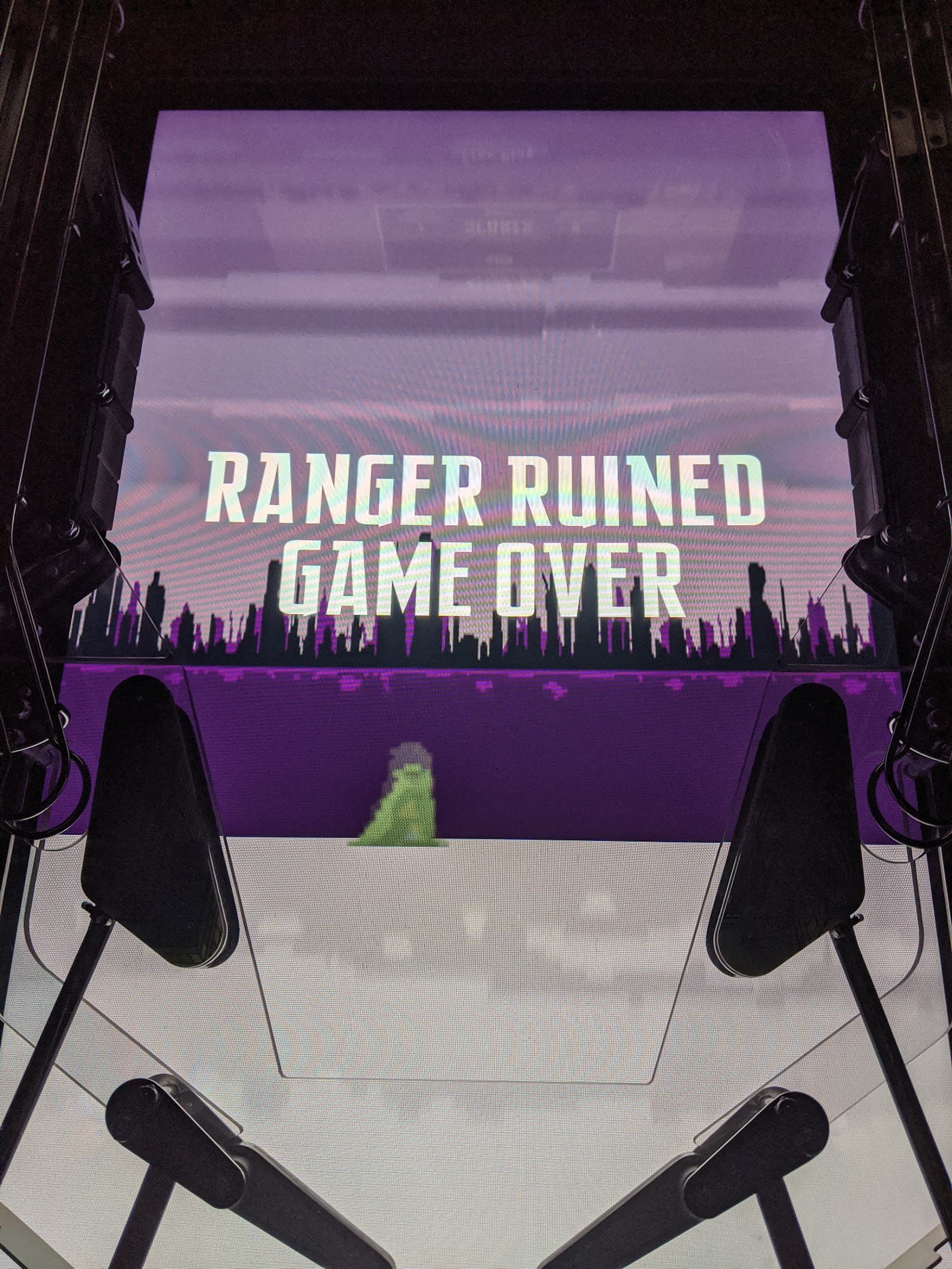 Game over screen with pixelated cityscape and "Ranger Ruined" text
