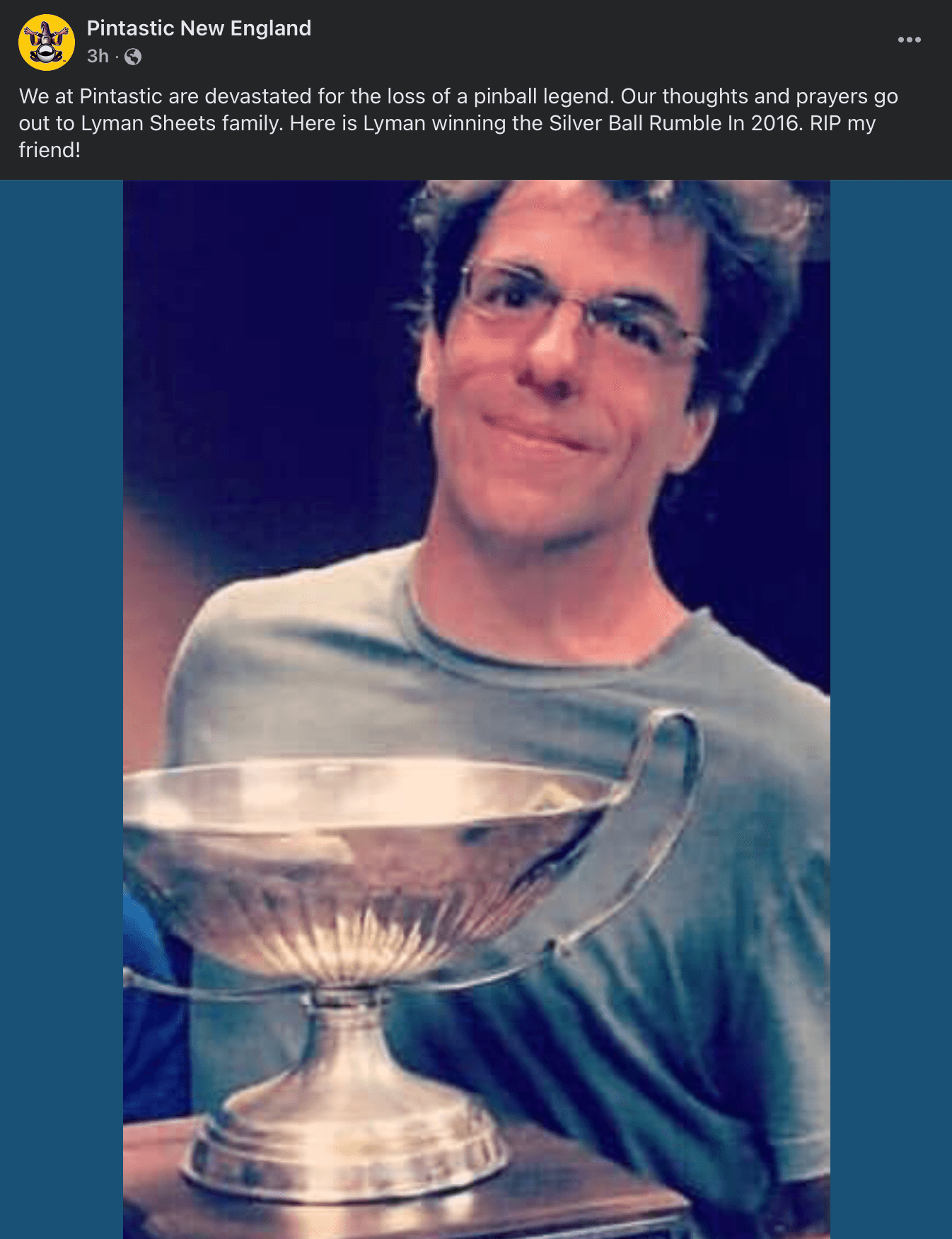 Smiling pinball champion holding Silver Ball Rumble trophy in 2016