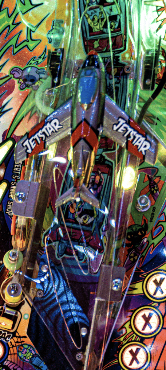Colorful pinball machine close-up with Jetstar theme and vibrant graphics
