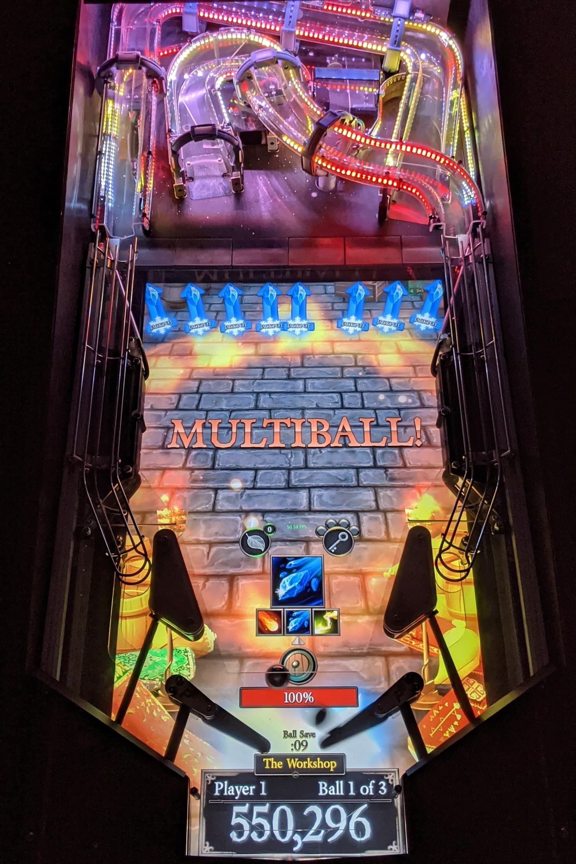Colorful pinball machine with multiball mode activated, glowing lights