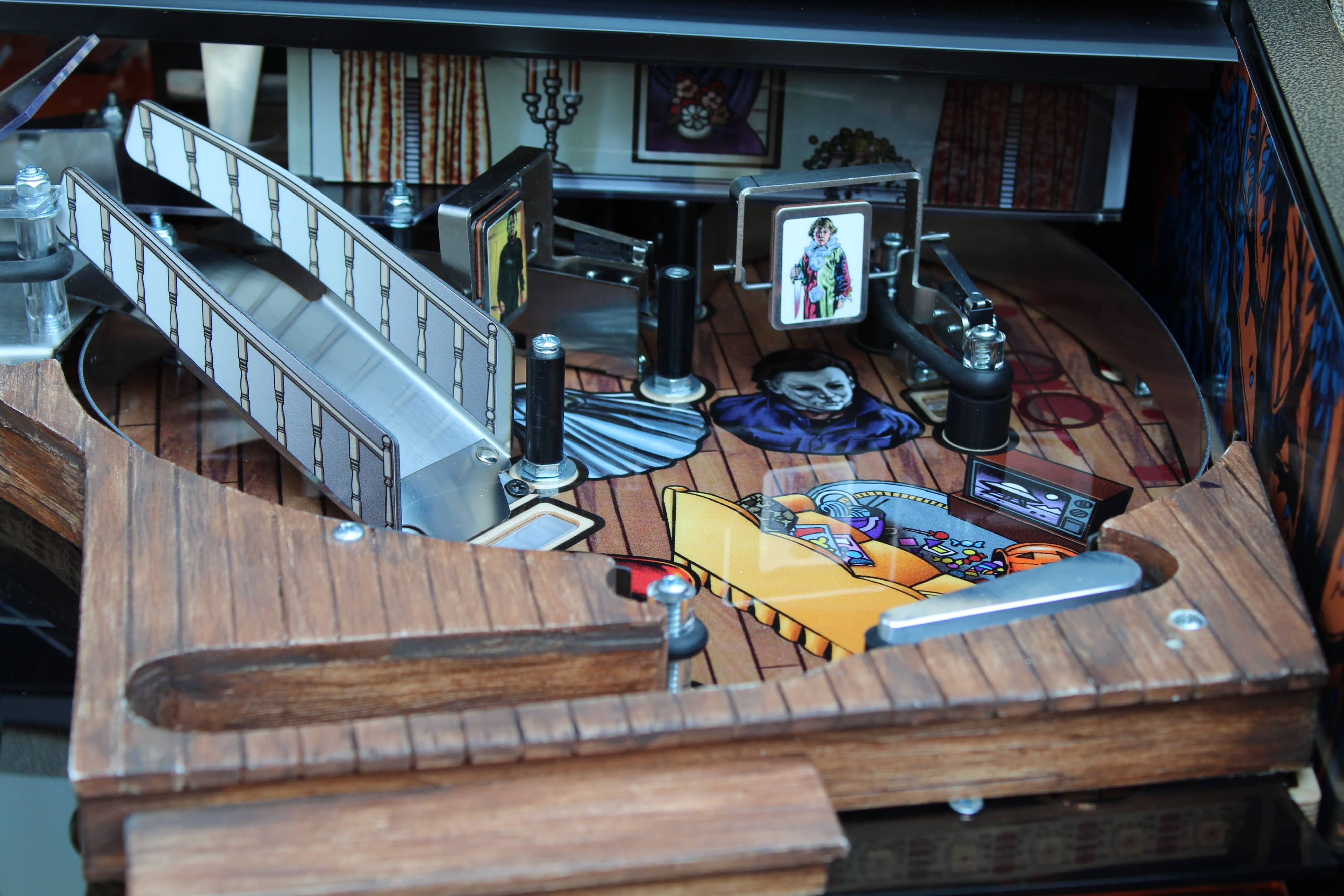 Vintage pinball machine with wooden board and colorful game elements