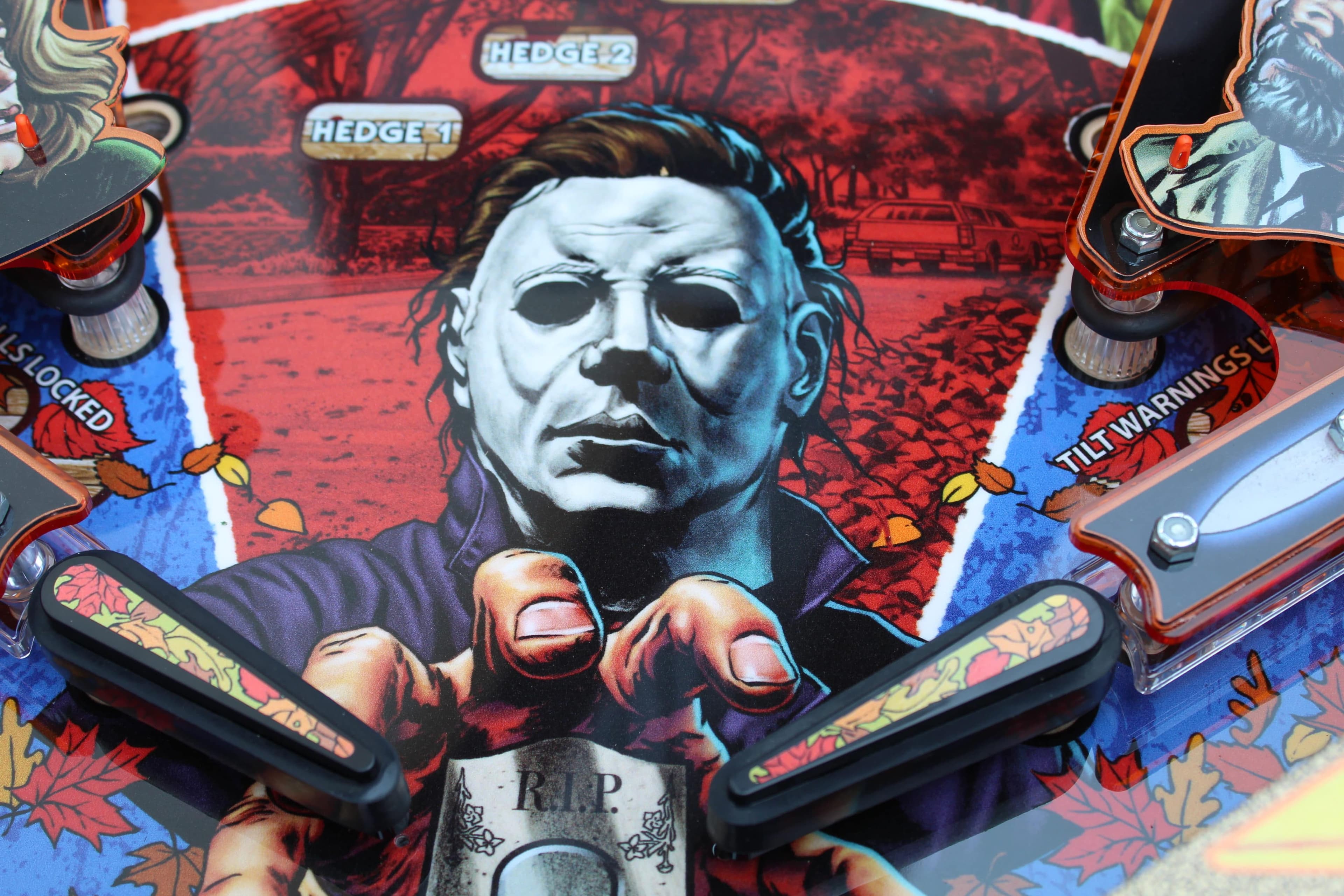 Michael Myers pinball machine art with haunting white mask on red background