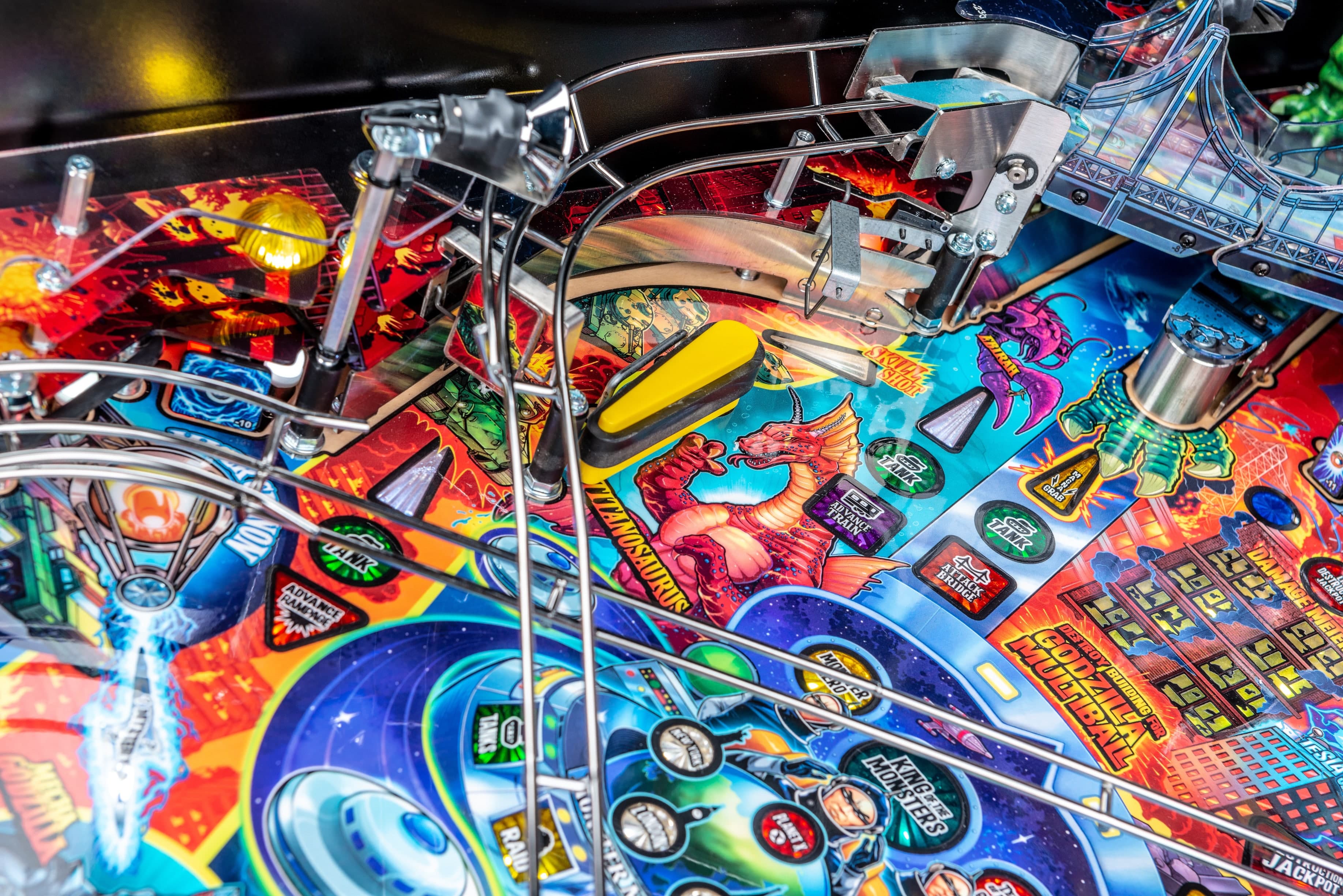 Colorful pinball machine with intricate design featuring dragons and sci-fi elements