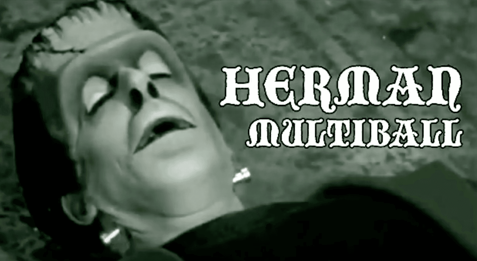 Black and white image of person with dramatic facial expression and Hernan Multiball text