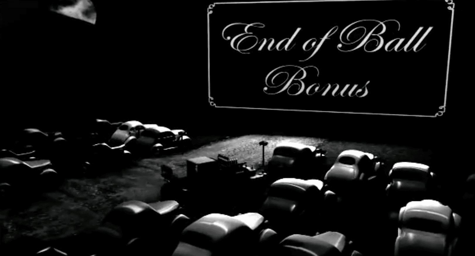 Black and white image of cars at end of ball with bonus sign