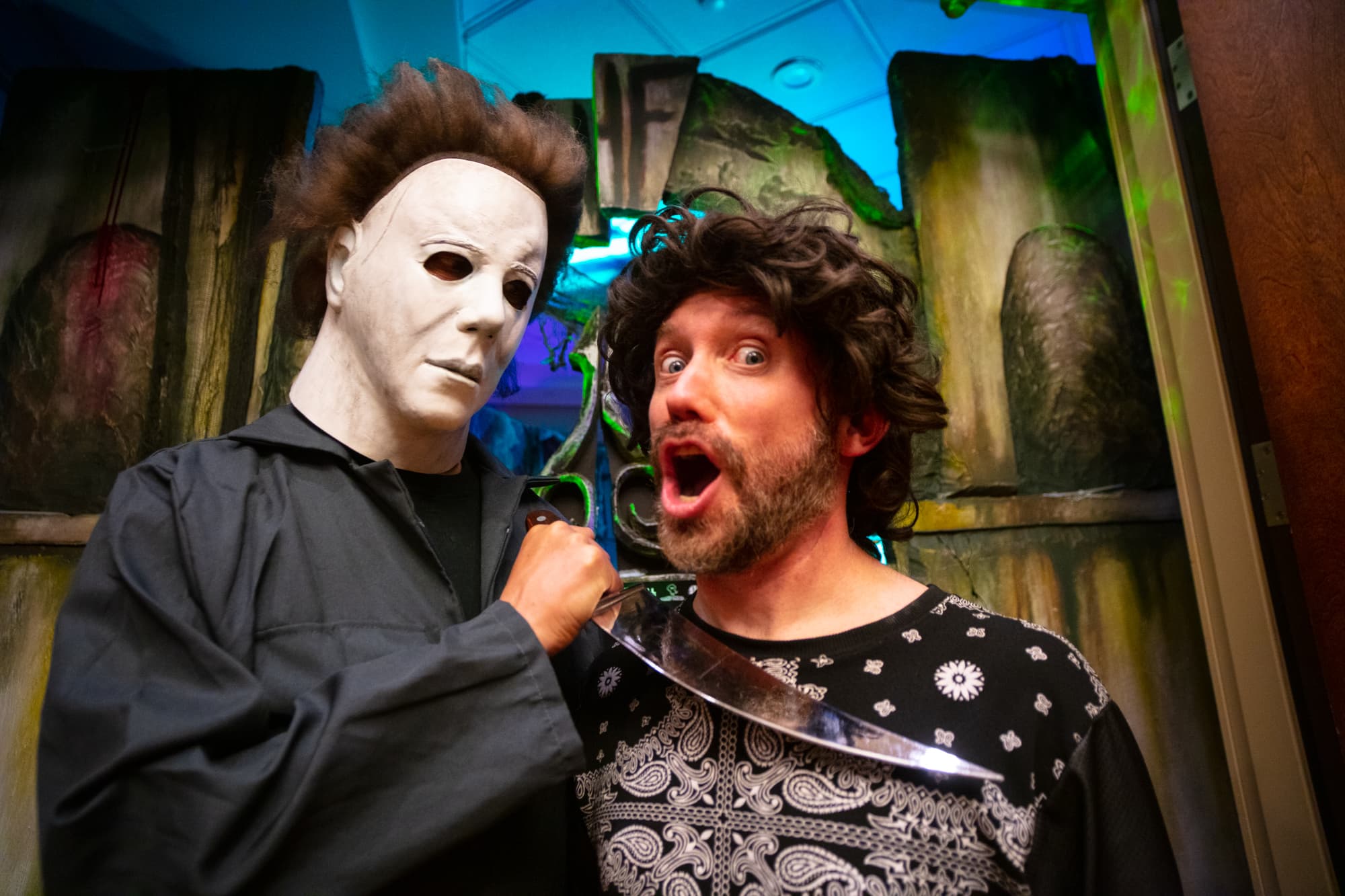 Michael Myers scary movie character posing with shocked fan