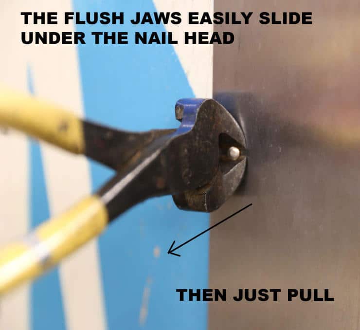 Close-up of pliers demonstrating nail removal technique with instructional text