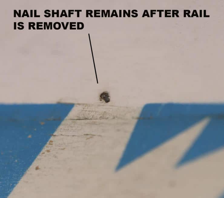 Nail shaft remaining in wood after rail is removed