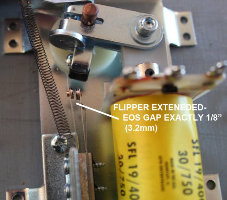Close-up of mechanical device with yellow component and precision measurement