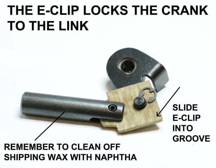 Metal and wooden mechanical components with instructions for e-clip assembly