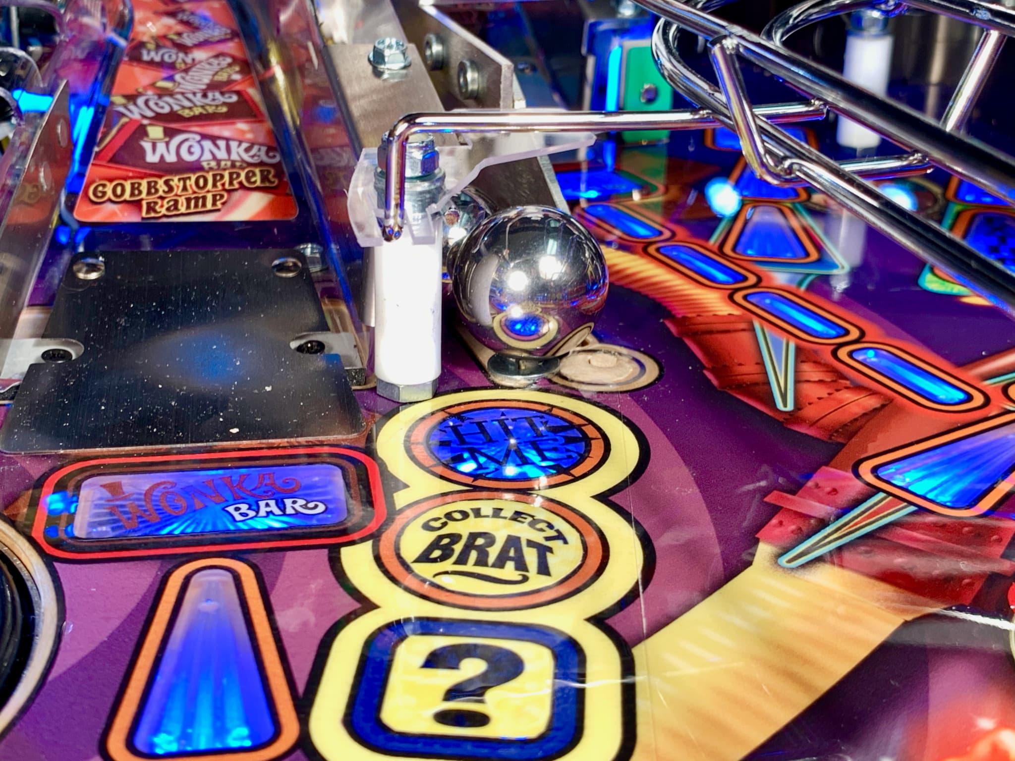 Wonka-themed pinball machine with colorful lights and silver ball